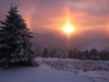 Coucher de soleil en hiver sur les forêts de La Bresse depuis le Refuge du Sotré au Haut-Chitelet.